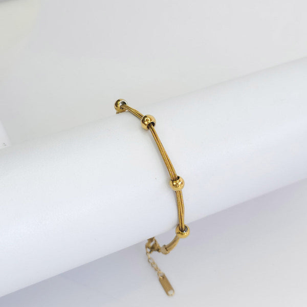 Pulsera Triple Dorada Esferas