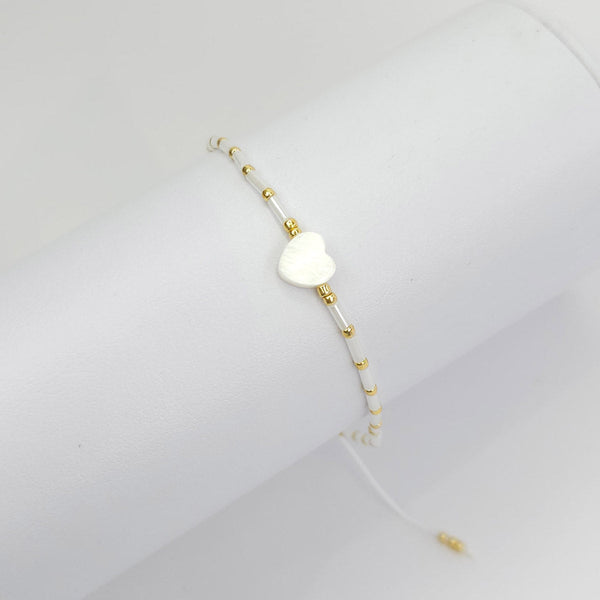 Pulsera Blanca con Bolitas Doradas