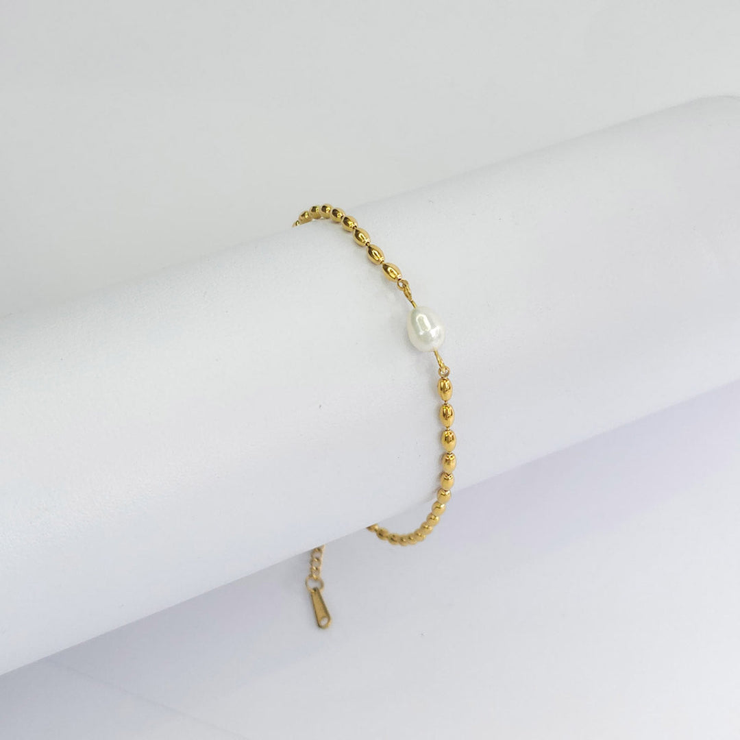 Pulsera dorada de cadena redonda con dije de perla