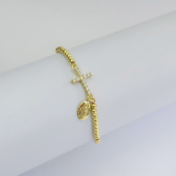 Pulsera de cuentas doradas con cruz de zirconias y dije Nuestra Señora