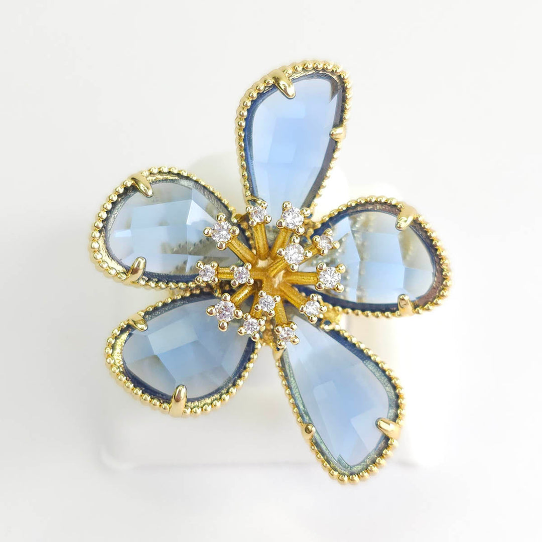 Anillo Flor con piedras azules ajustable